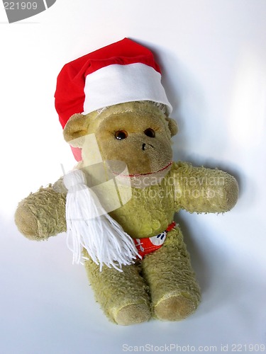 Image of Vintage monkey toy in a Christmas hat