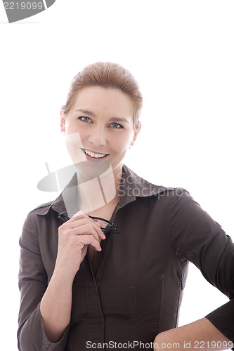 Image of Smiling businesswoman holding her glasses