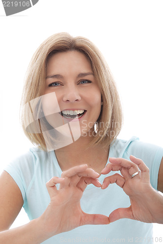 Image of Laughing woman making a heart gesture