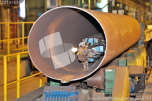 Image of industrial machine for making steel pipes