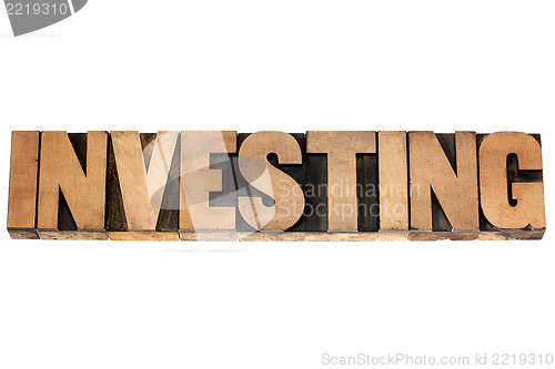 Image of investing word in wood type