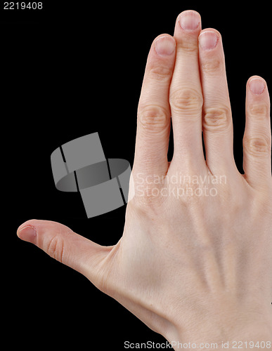 Image of White hand on black