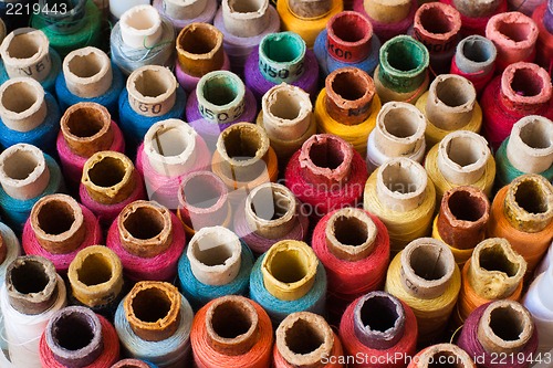 Image of Colorful reels of threads background - A series of TAILOR related images.