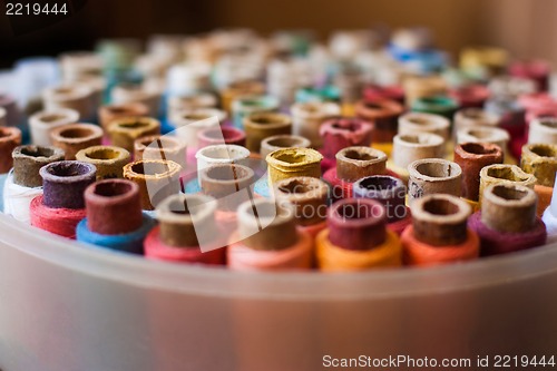 Image of Colorful reels of threads background - A series of TAILOR related images.