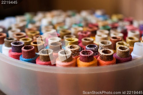 Image of Colorful reels of threads background - A series of TAILOR related images.