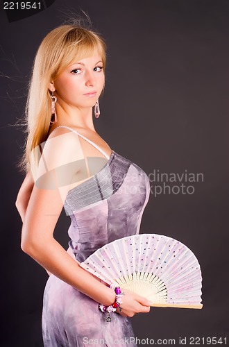 Image of Pretty woman with fan