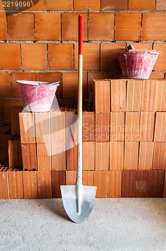 Image of Masonry bricks, Shovel and buckets