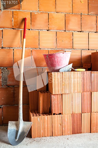 Image of Masonry Shovel bucket and bricks