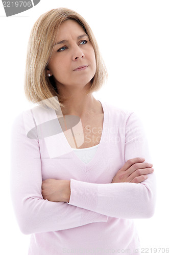 Image of Pensive woman standing with folded arms