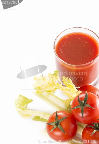 Image of Glass of tomato juice and tomatoes on a white background