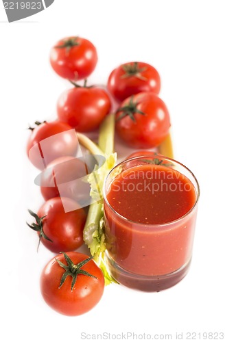 Image of Glass of tomato juice and tomatoes