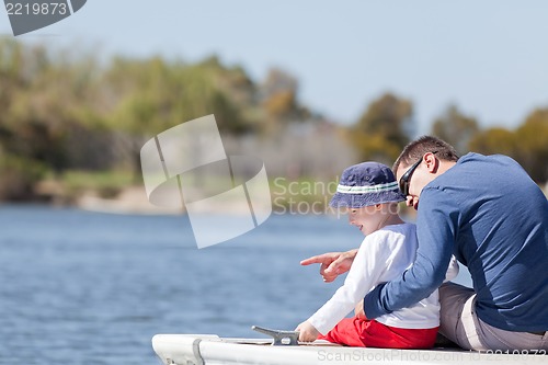 Image of family at a marina dock