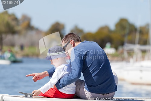 Image of family at a marina dock