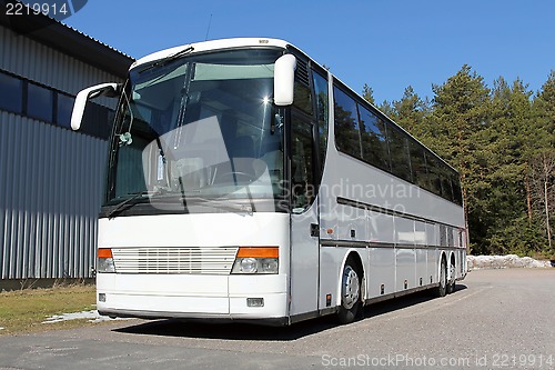 Image of White Coach Bus Parked