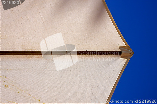 Image of abstract parasol and blue  