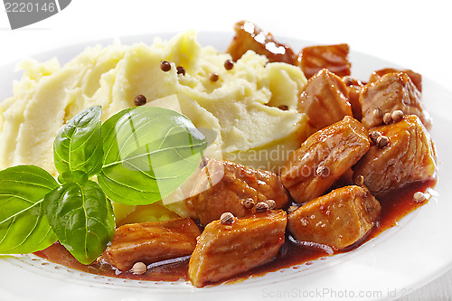Image of mashed potatoes and meat stew