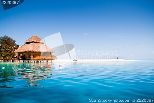 Image of Over water bungalows with steps into amazing green lagoon