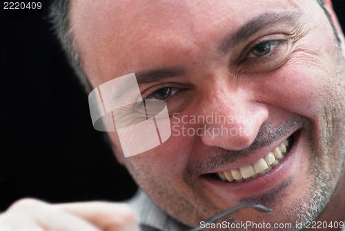 Image of Close up portrait of smiling man