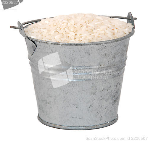 Image of White long grain rice in a miniature metal bucket