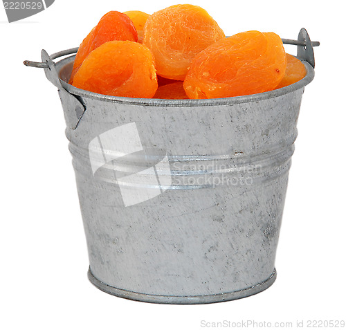 Image of Dried apricots in a miniature metal bucket