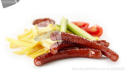 Image of grilled sausages and french fries