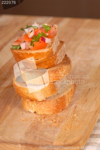 Image of Stack of bruschetta on a cutting board