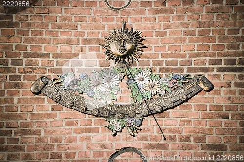 Image of Sundial on brick wall