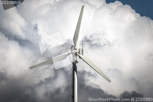 Image of Windmill with storm clouds