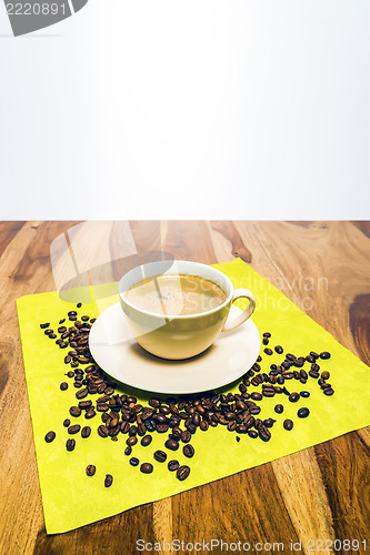 Image of Coffee with beans on serviette