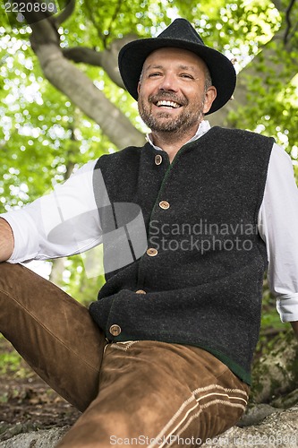 Image of Laughing man in Bavarian costume