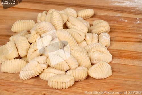 Image of Freshly made potato gnocchi on a cutting board