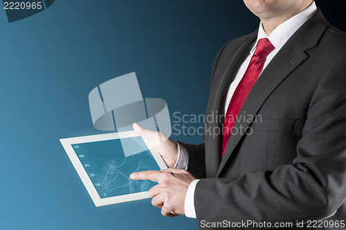 Image of Man with chart on tablet