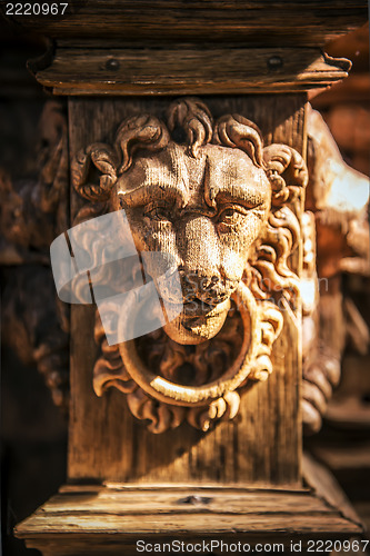 Image of Face of a carved wooden lion