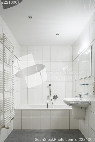 Image of White tiled bathroom