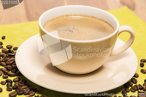 Image of Cup of coffee with beans