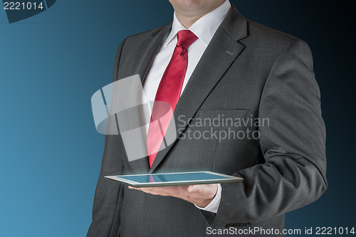 Image of Business man with tablet