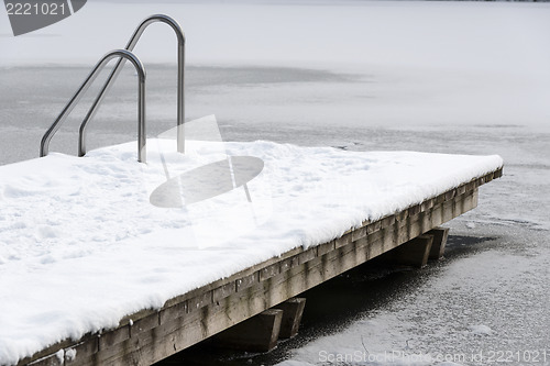 Image of Pool ladder on a frozen lake