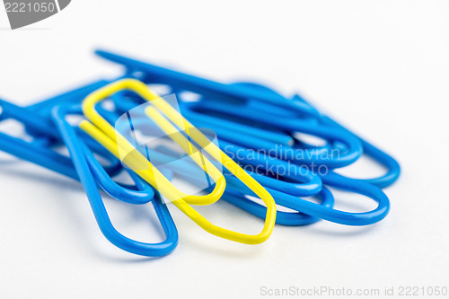 Image of Yellow paperclip with lots of blue
