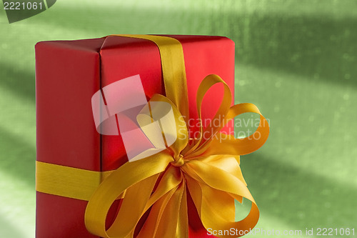 Image of Red present on green background