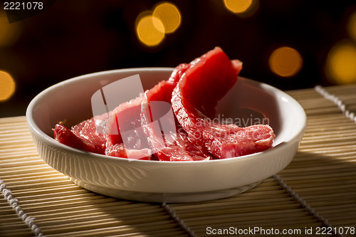 Image of Sliced raw meat in white bowl