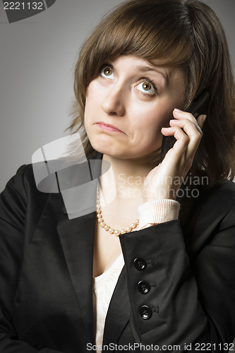 Image of Business woman wonders on mobile