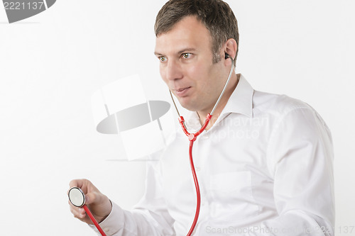 Image of Man is holding stethoscope