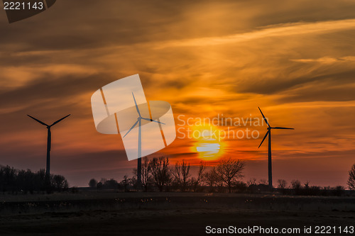 Image of Three windmills with sunset