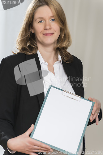 Image of Pregnant business woman with folder