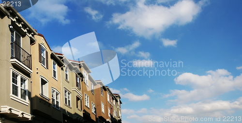 Image of Modern houses and sky with clouds