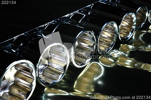 Image of close up socket set on reflective surface