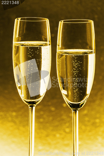 Image of Champagner with gold background