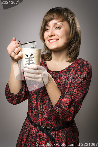 Image of Woman prepares tea