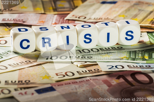 Image of Crisis letters with banknotes