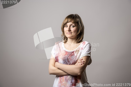 Image of Young girl with arms crossed